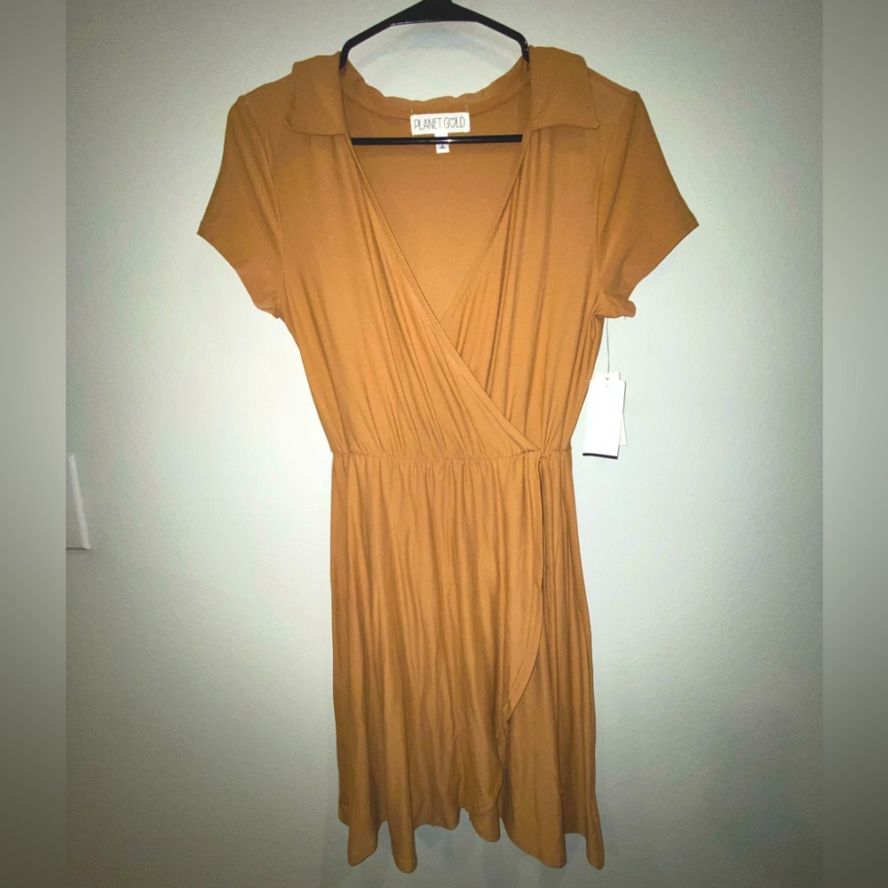 Tan wrap dress.. never worn still has tags